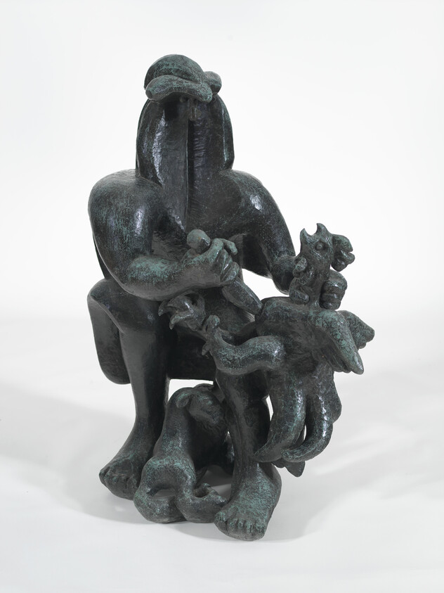 Bronze sculpture of a seated humanoid figure holding multiple small animal forms, including a bird and serpent.