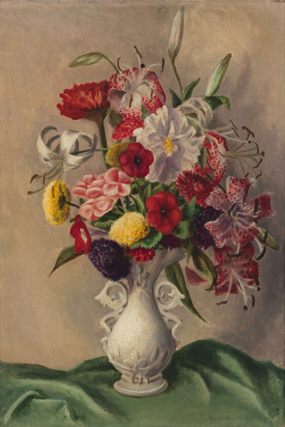 A white ornate vase holding a colorful mixed bouquet of lilies, carnations, and other flowers.