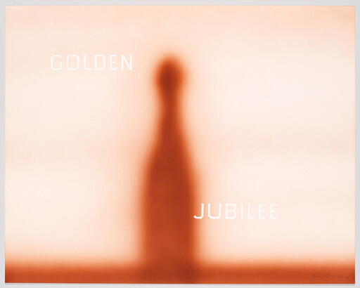 Blurred golden-orange silhouette of a tall bottle or column with the words Golden Jubilee.