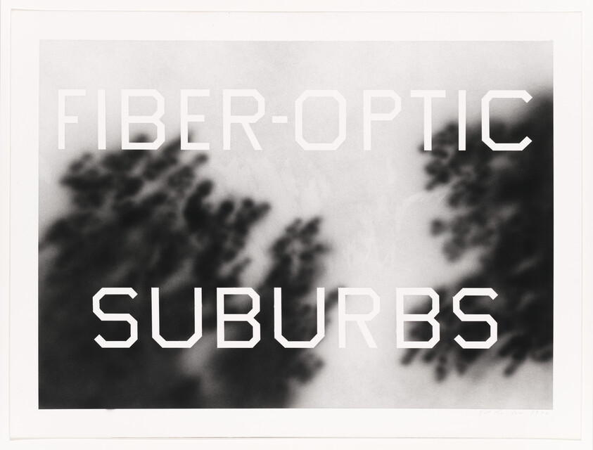 Black and white artwork with the words "FIBER-OPTIC SUBURBS" over a blurred background of trees.