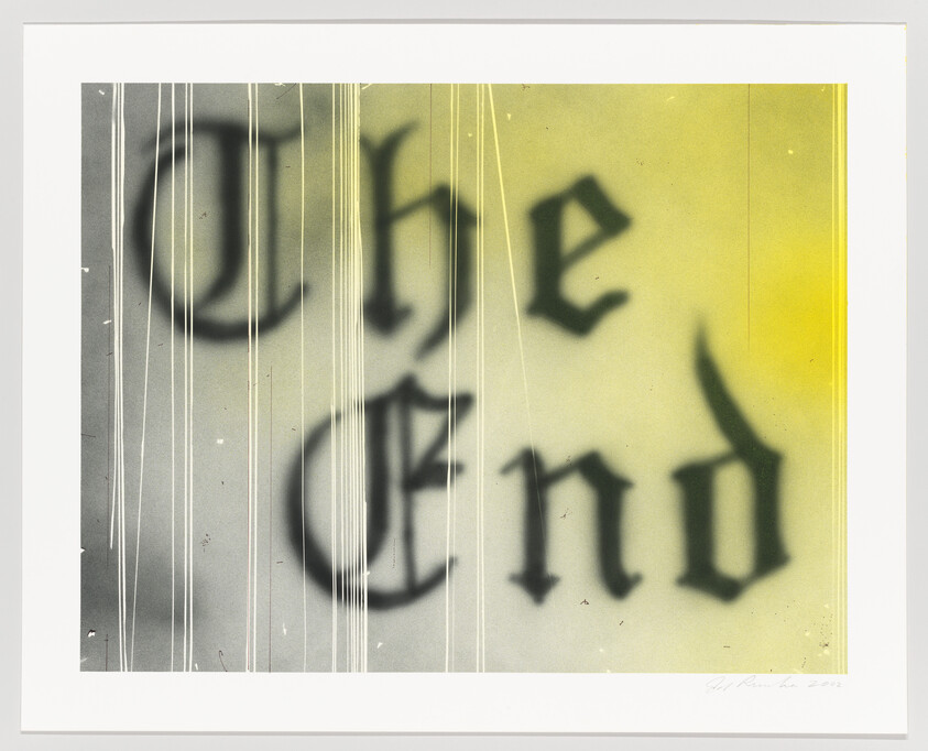 Gothic-style words "The End" blurred on a yellow-tinted background with vertical streaks.