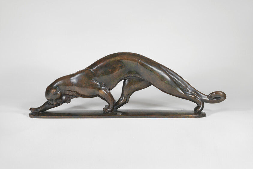 Bronze sculpture of a sleek panther stretching forward with arched back and curled tail.