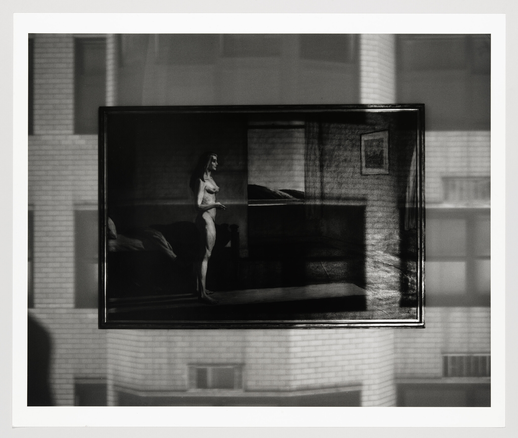 Framed painting of a nude woman standing in a dim bedroom reflected against a building window.