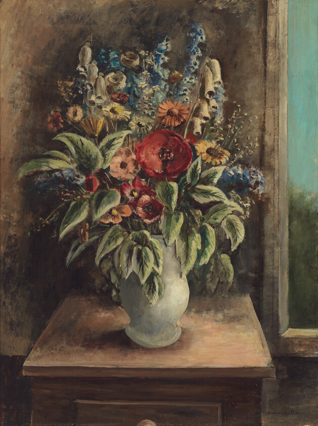 A ceramic vase of mixed flowers, including a large red bloom, sits on a wooden table by a window.