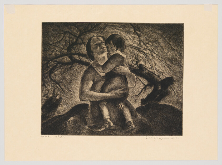 A parent sitting and holding a young child closely beneath bare tree branches.