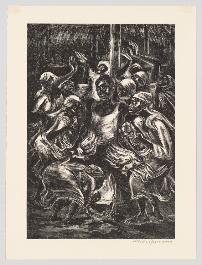 A group of people in headscarves dancing and clapping energetically around a central figure.