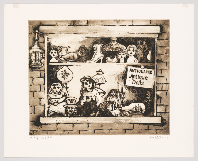 A storefront window filled with antique dolls, toys, and a handwritten "Antique Dolls" sign.