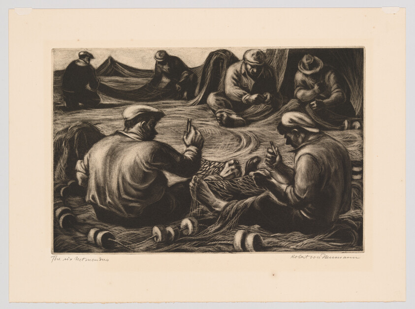 Seven fishermen sit in a circle mending and sorting fishing nets on a shore.
