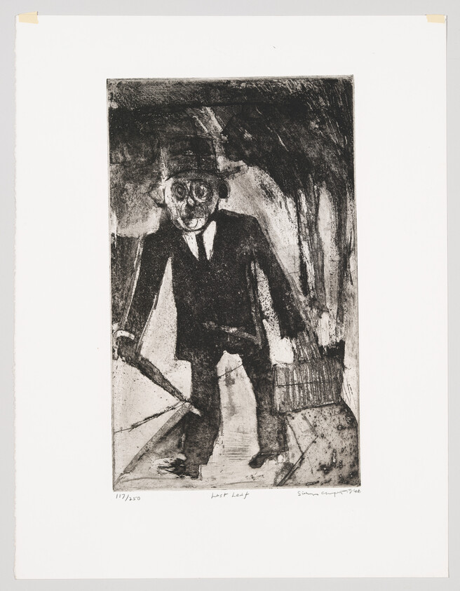 A man in a suit and hat holds an umbrella and a basket on a dark street.