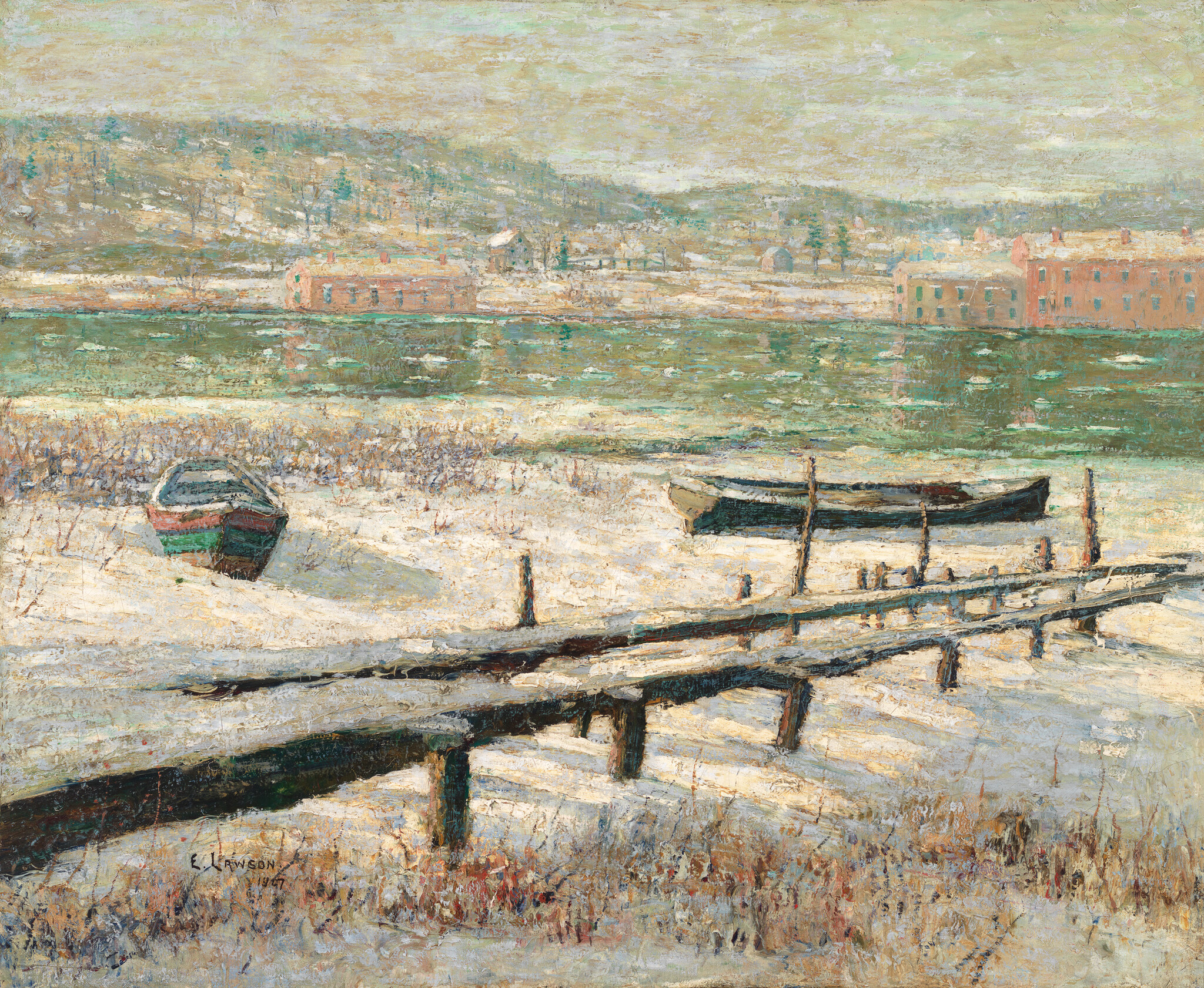Two small boats rest on a snowy shoreline beside a wooden pier with green river water.