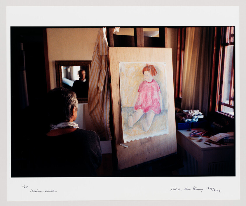 An artist sits facing an easel displaying a pastel drawing of a child in a pink dress.