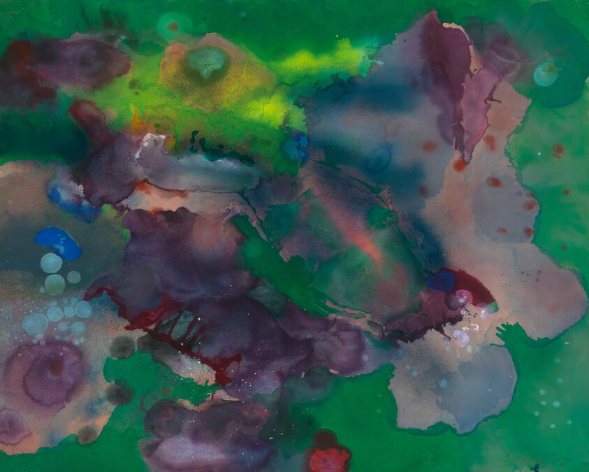 Bright green, purple, and blue watercolor paint spreads and blends across the canvas in an abstract pattern.