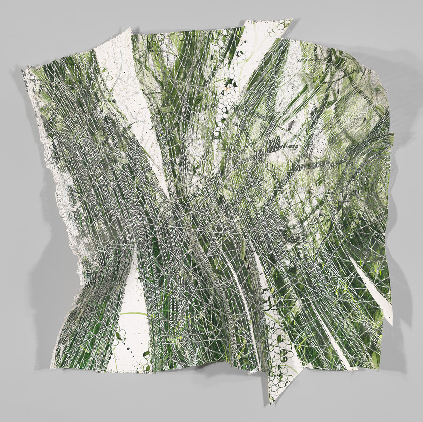 A torn green-and-white abstract artwork with overlapping linear patterns and dotted textures on paper.
