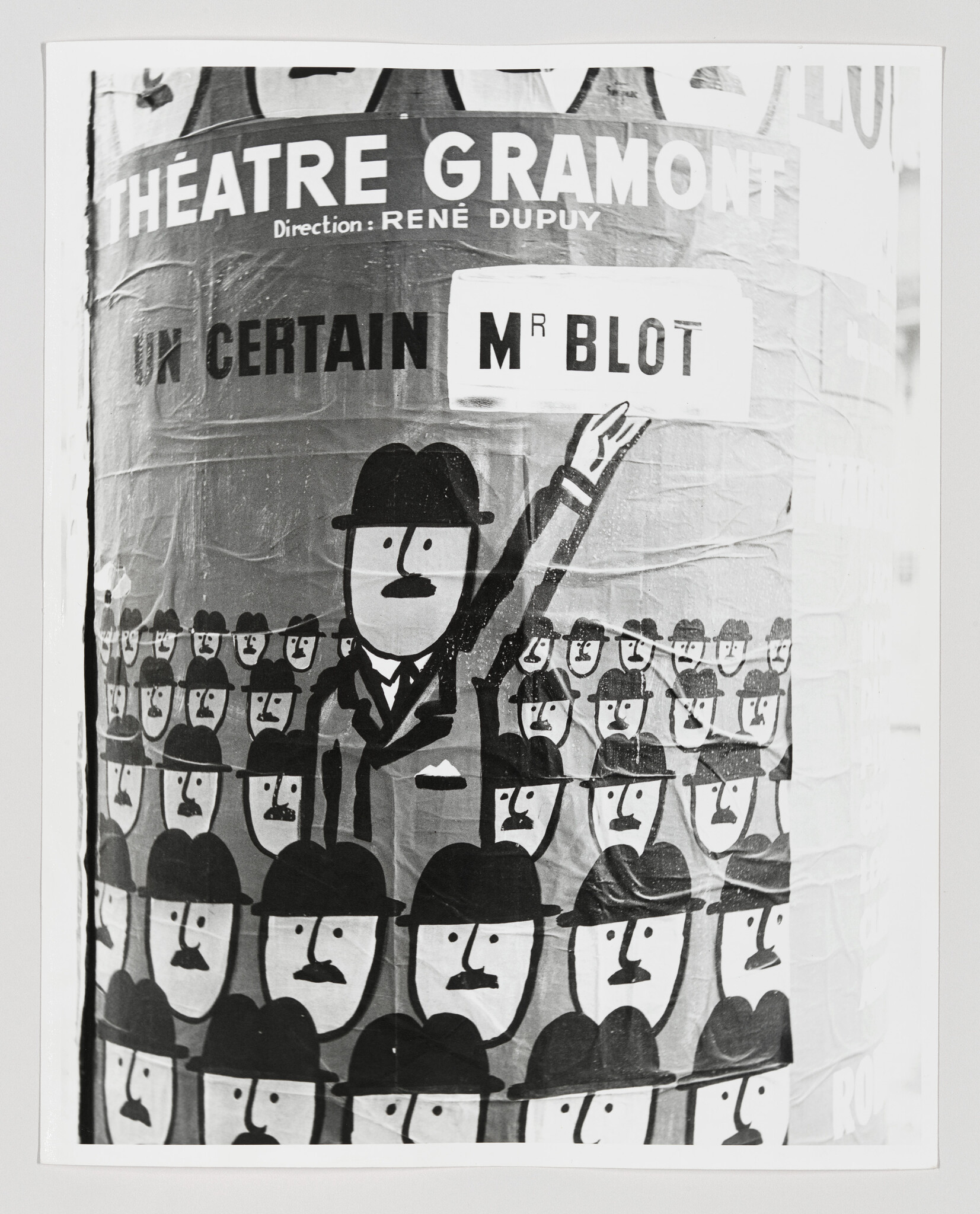 A poster showing many identical bowler-hatted men and one man holding a sign reading Mr Blot.