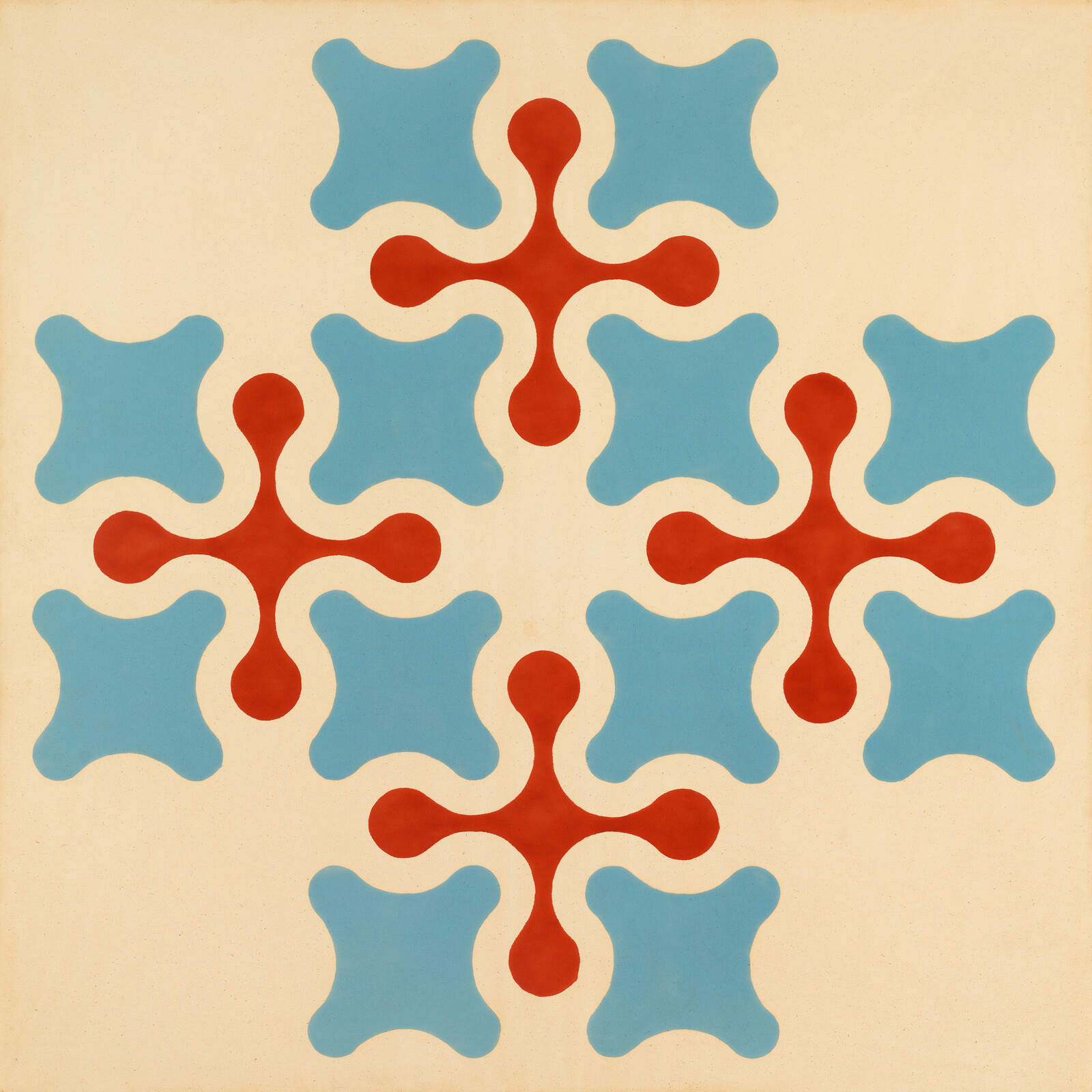 Red four-armed star shapes alternate with blue rounded square motifs on a cream background.