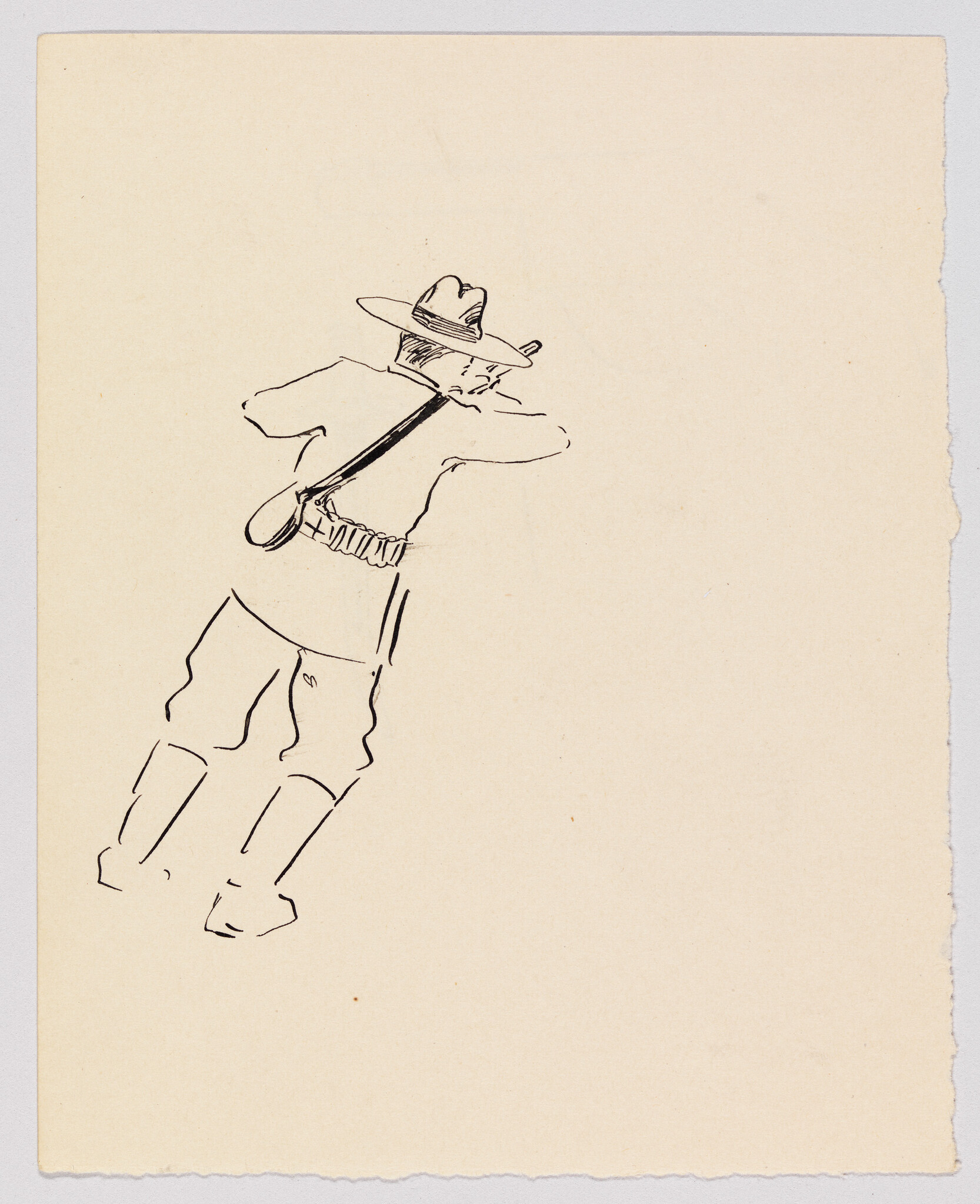 A soldier leaning forward with a rifle slung over his shoulder and an ammunition belt.