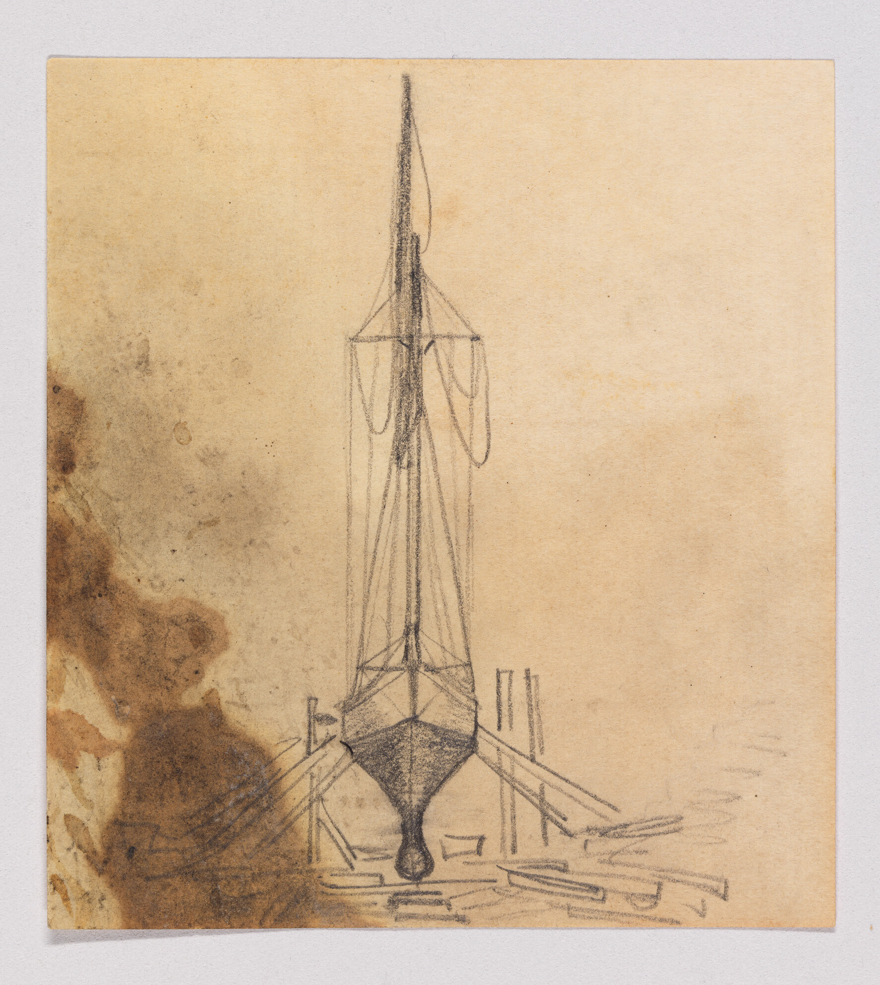 A pencil sketch of a boat's hull and tall mast supported on blocks in a dry dock.