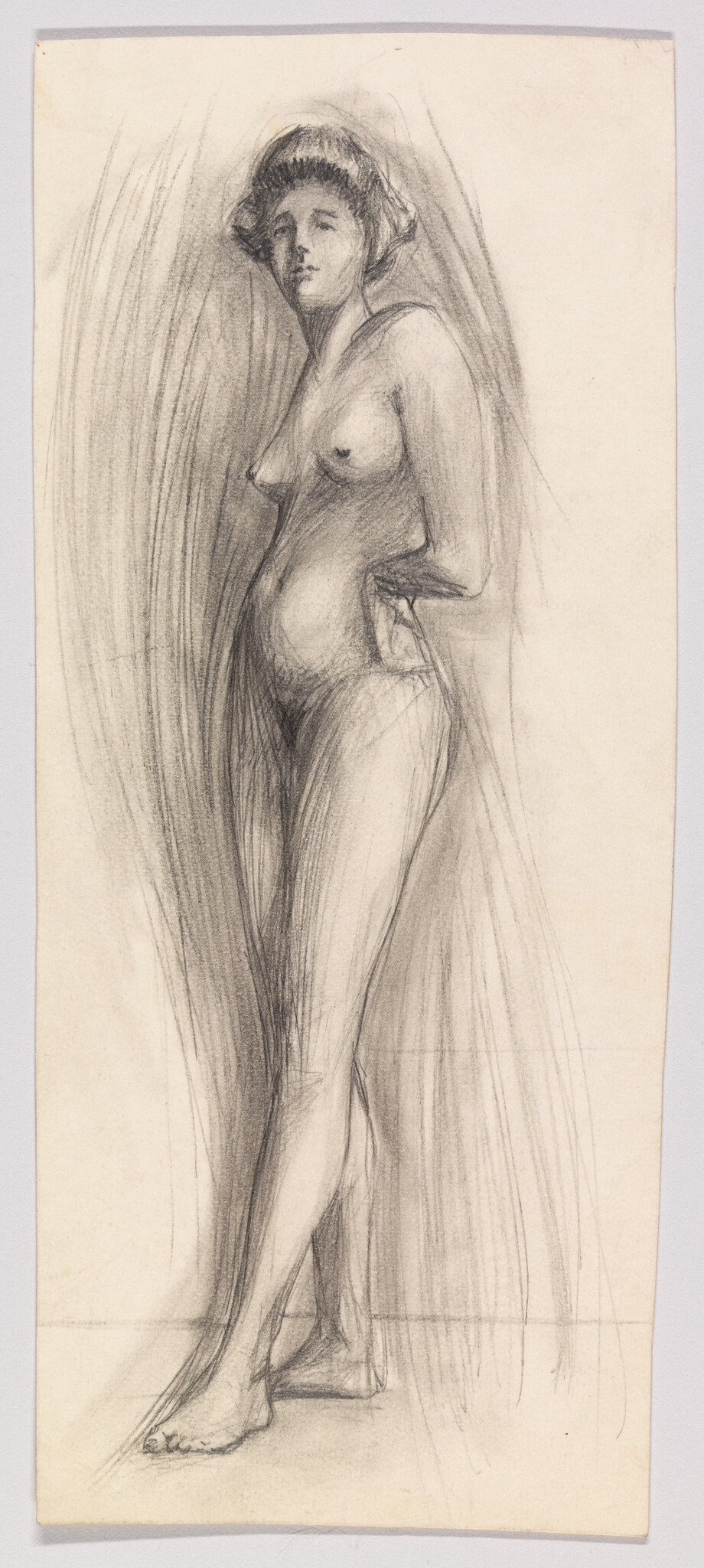 Nude woman standing with one hand on her hip and looking forward.