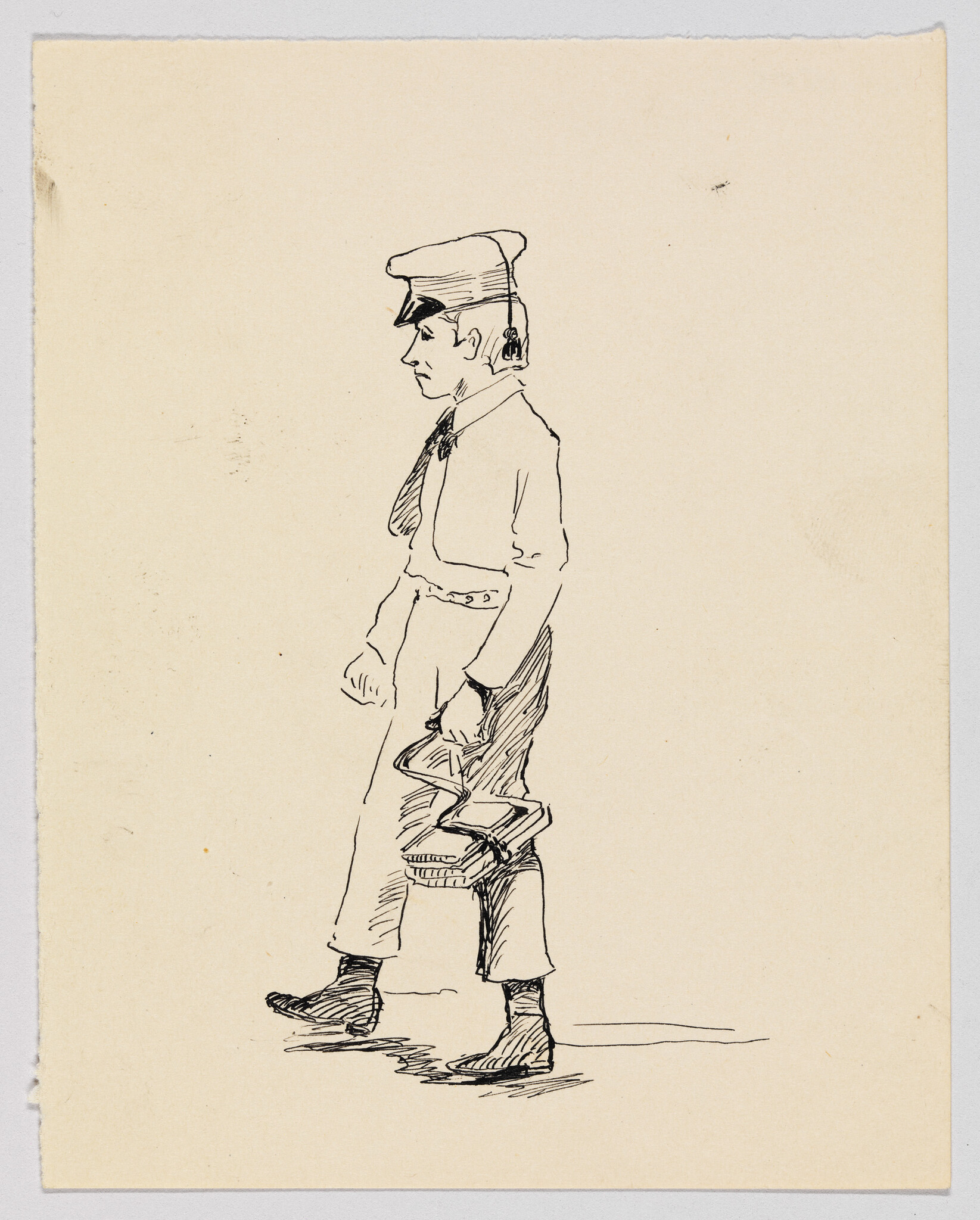 Young boy in a cap walks forward carrying a folded satchel or bundle.