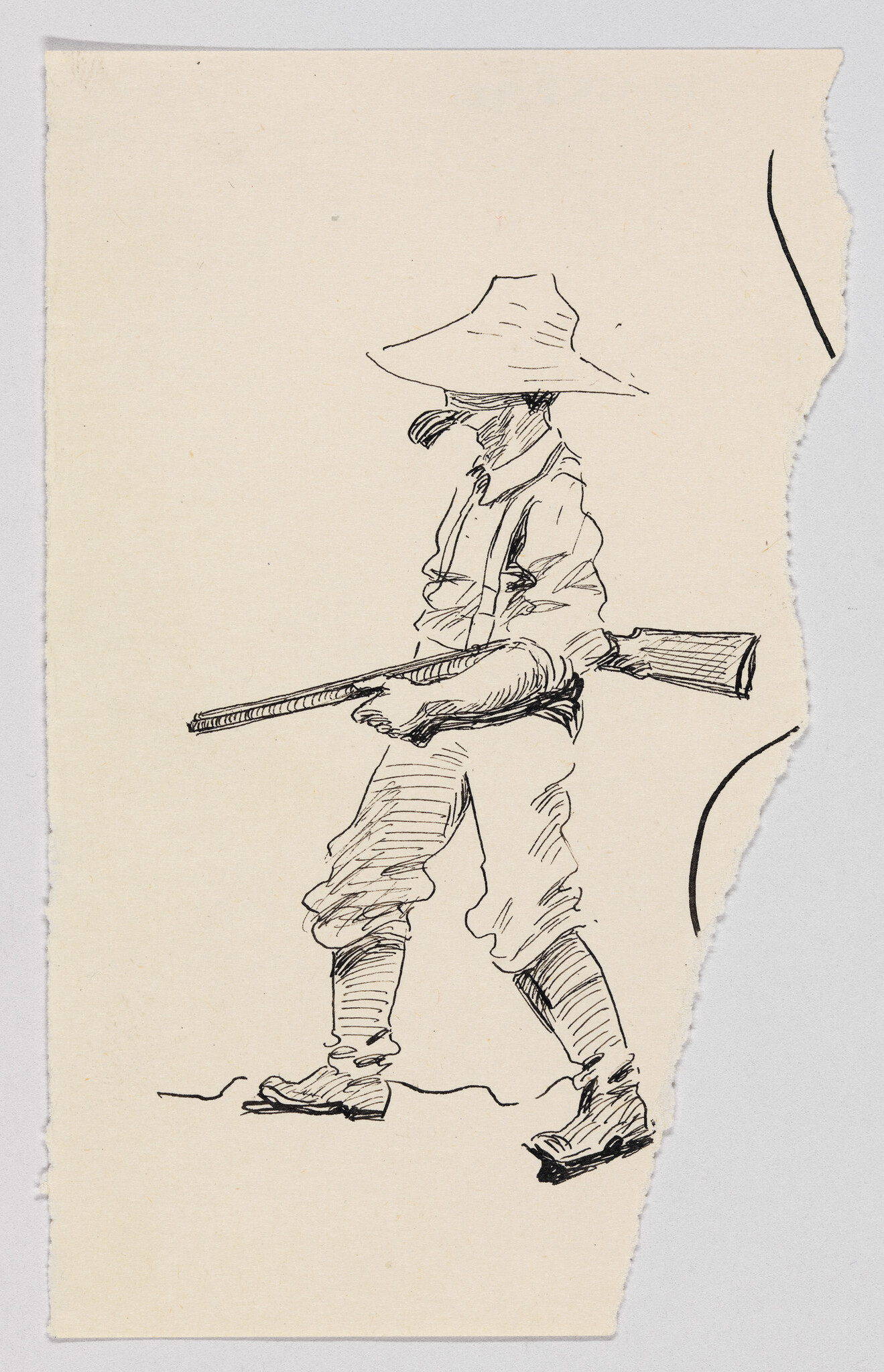 A man wearing a wide-brim hat walks carrying a rifle over his shoulder.