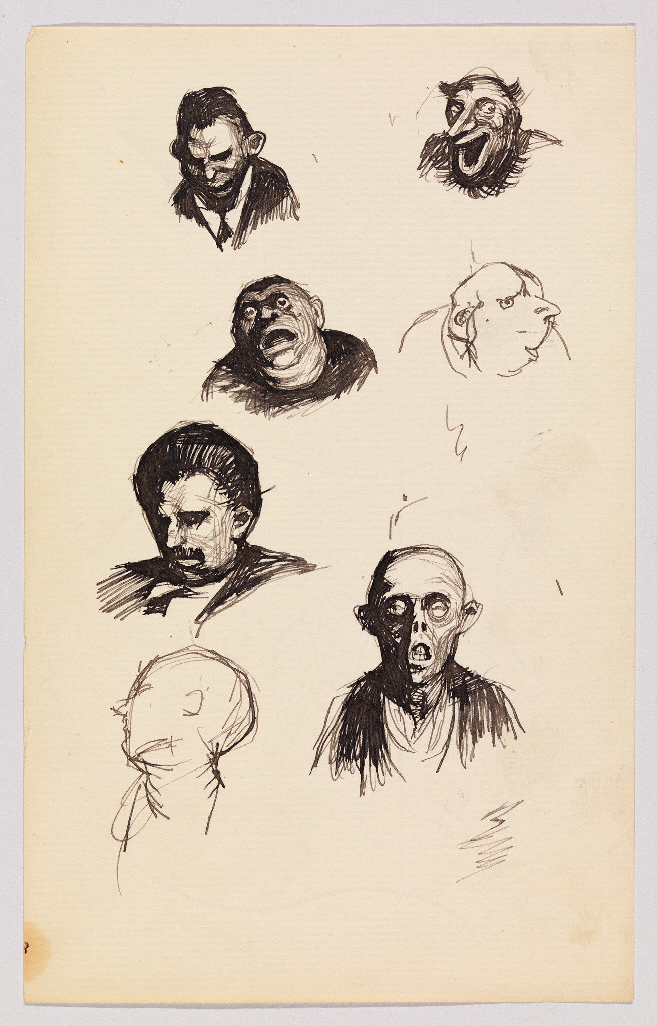 Several quick ink sketches of expressive, exaggerated faces and head studies on a cream sheet.