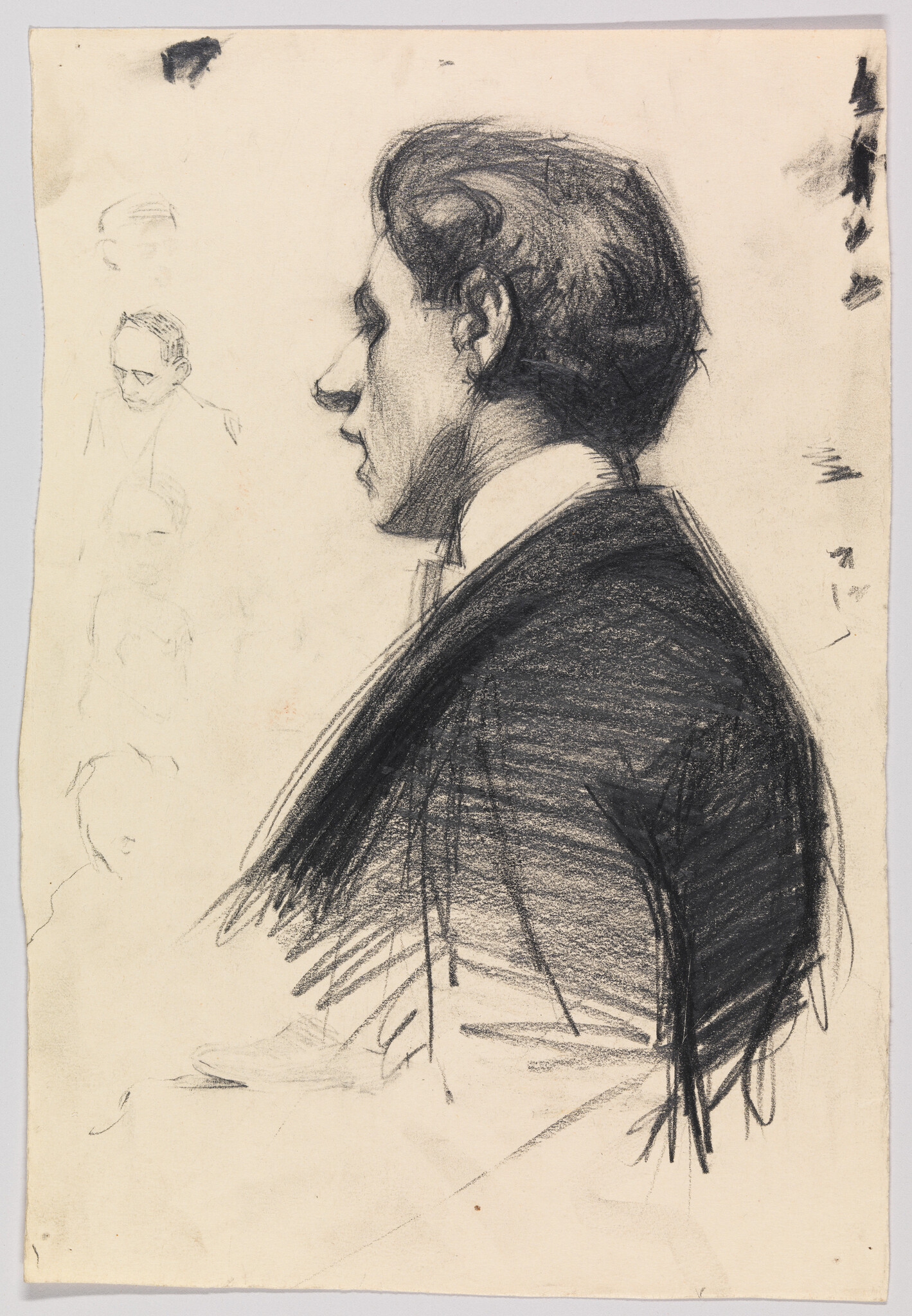 Young man in a suit shown in a charcoal profile sketch, facing left.