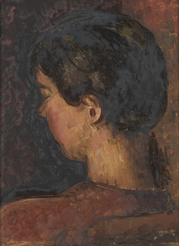 A person with short dark hair is shown from behind, head turned slightly to the left.