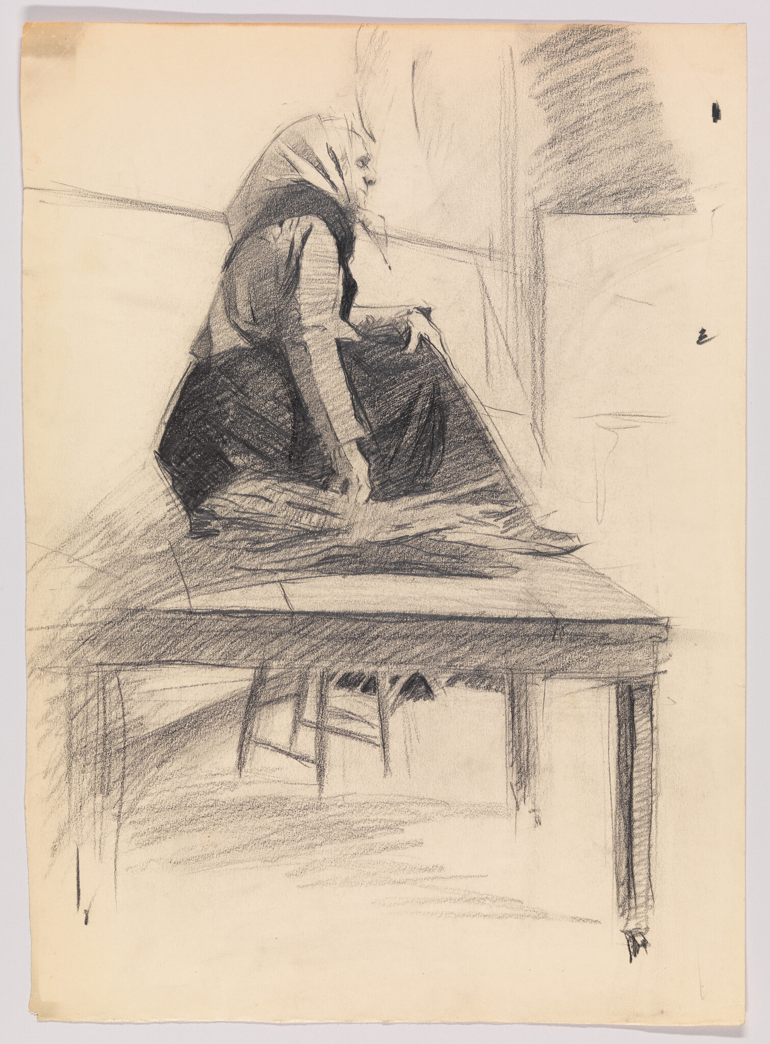 An elderly woman wearing a headscarf sits on a raised table, looking to the right.