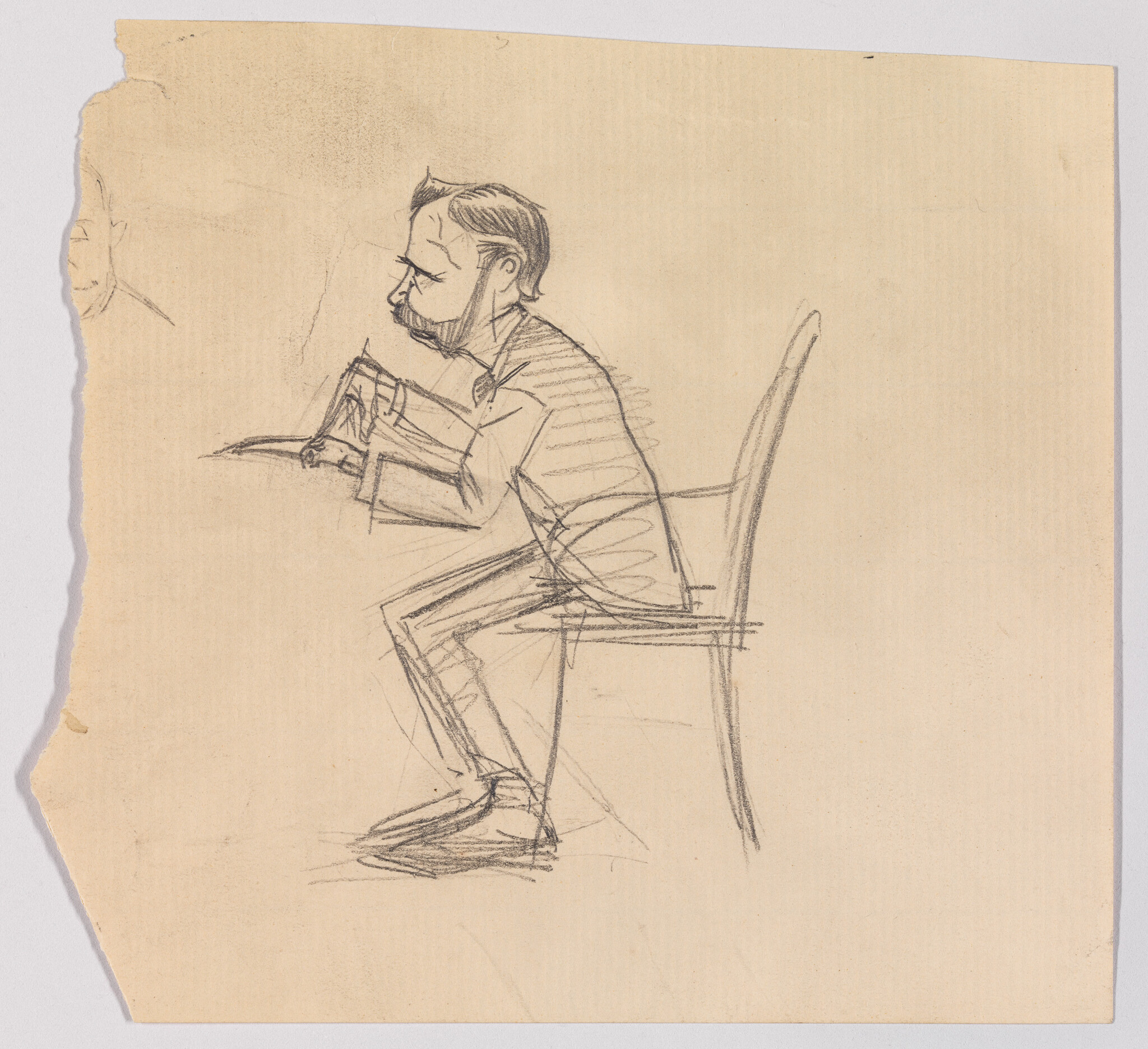 A man with a mustache sits hunched on a chair leaning forward with hands clasped.