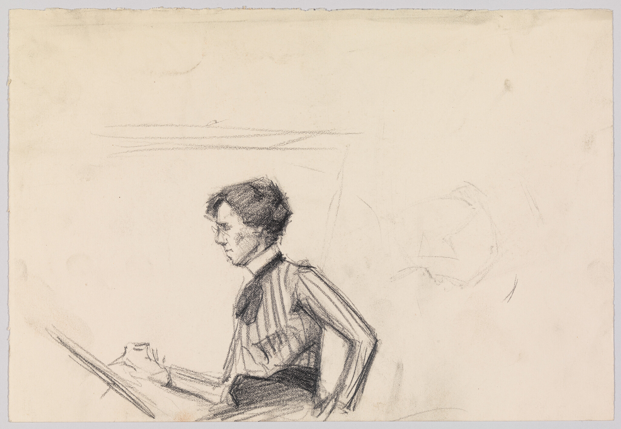 A woman in a striped blouse sits at a drawing board, concentrating on her work.