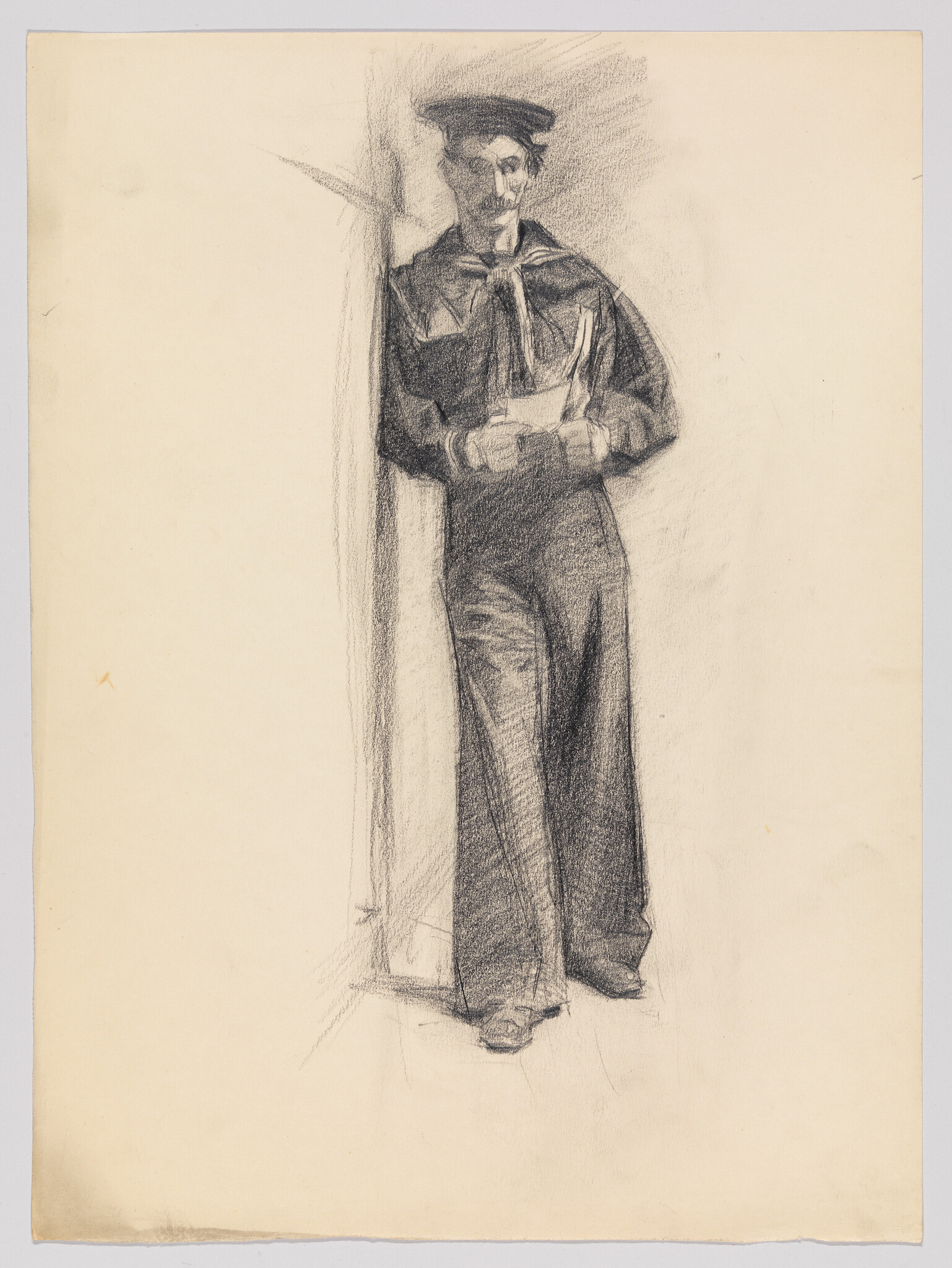 A sailor in uniform leans against a post while holding and reading a folded letter.