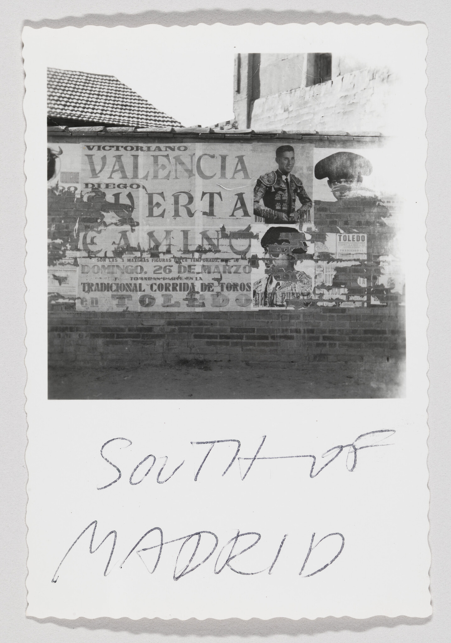 Worn bullfighting poster featuring matadors on a brick wall with handwritten "south of Madrid" below.