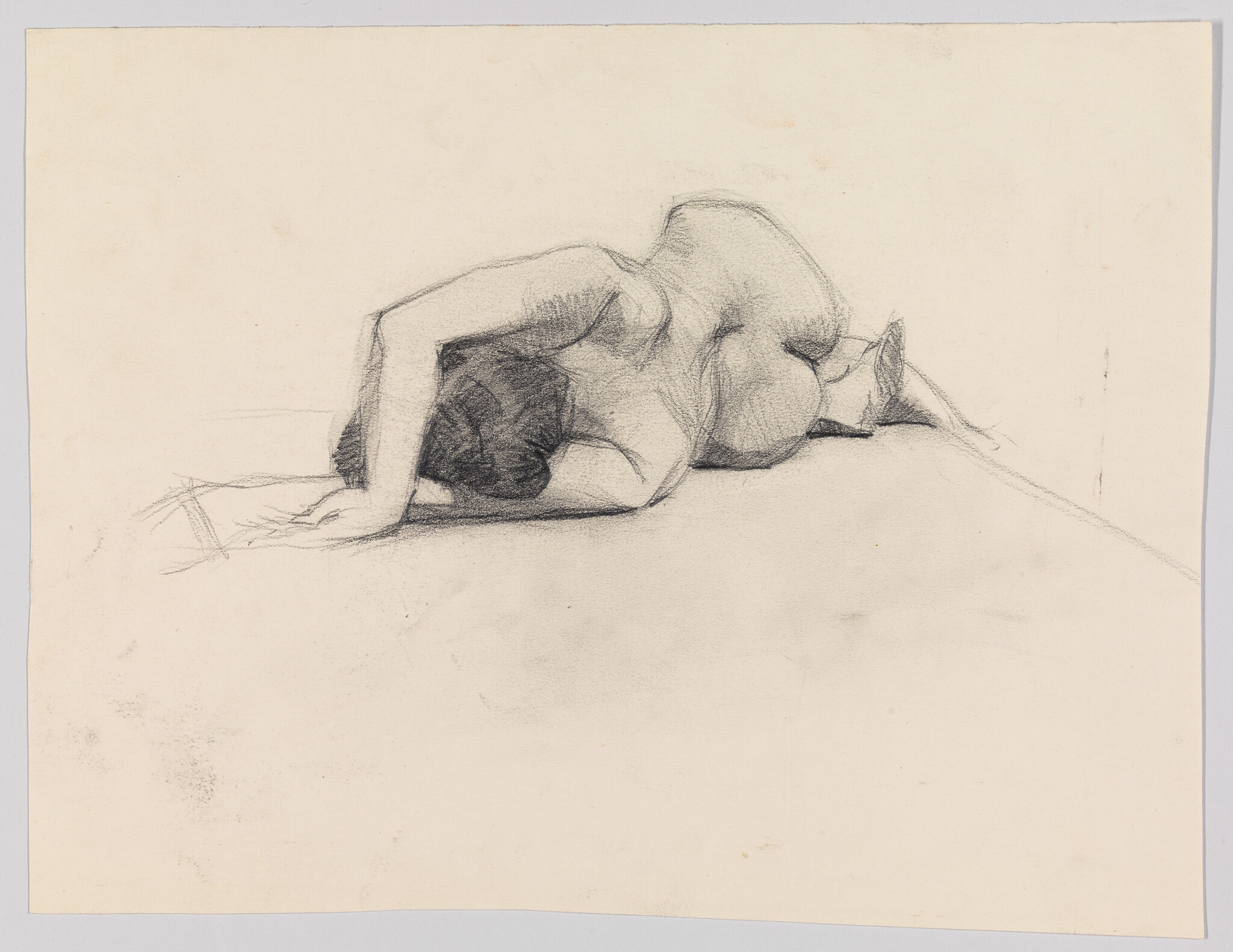 A charcoal sketch of a nude woman lying face down with one arm draped over her head.