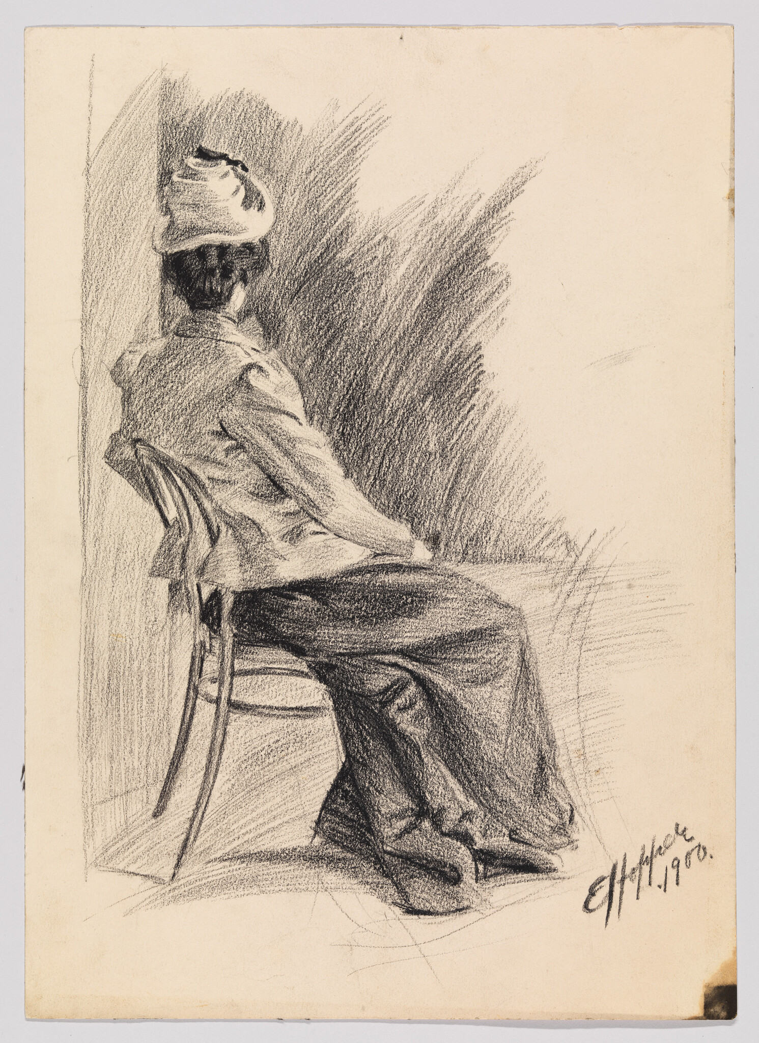 A woman wearing a hat sits turned away on a wooden chair, hands resting in her lap.