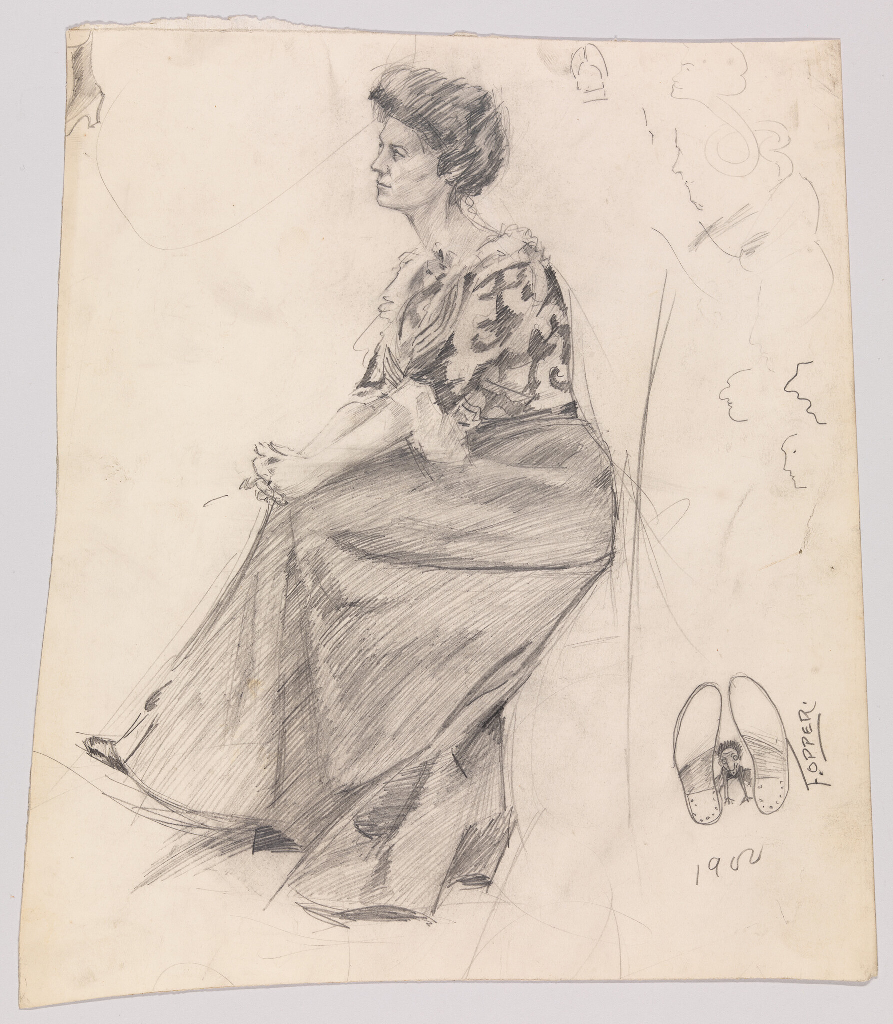 Seated woman in profile wearing a long skirt and patterned blouse, hands clasped in her lap.