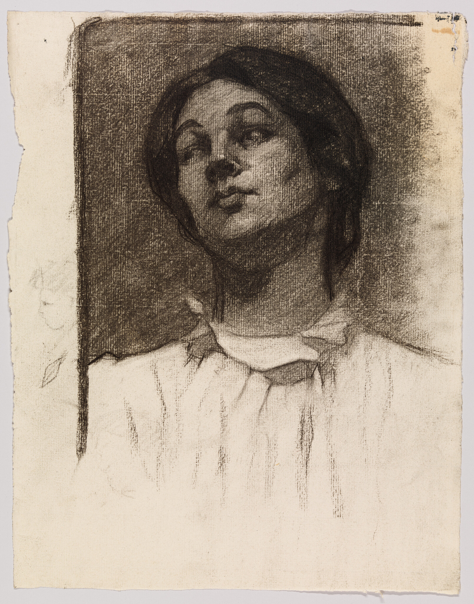 A charcoal portrait of a young woman looking slightly upward with a loose blouse and contemplative expression.