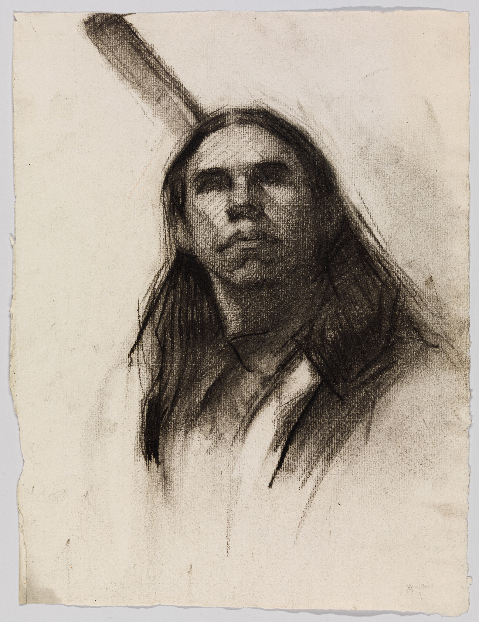 A charcoal portrait of a person with long hair looking upward on textured paper.