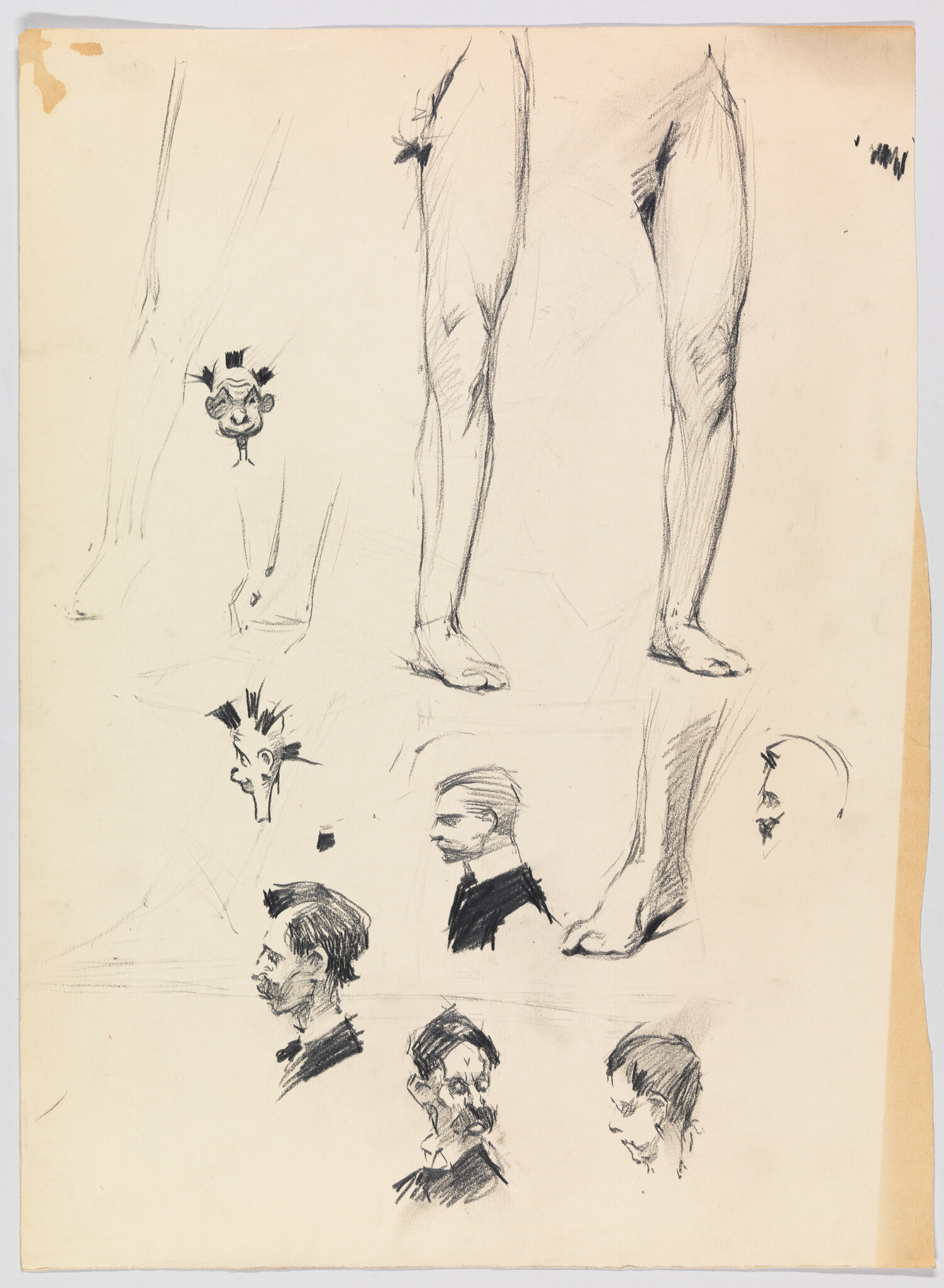 Pencil sketches showing study of male legs and several men's head portraits on paper.