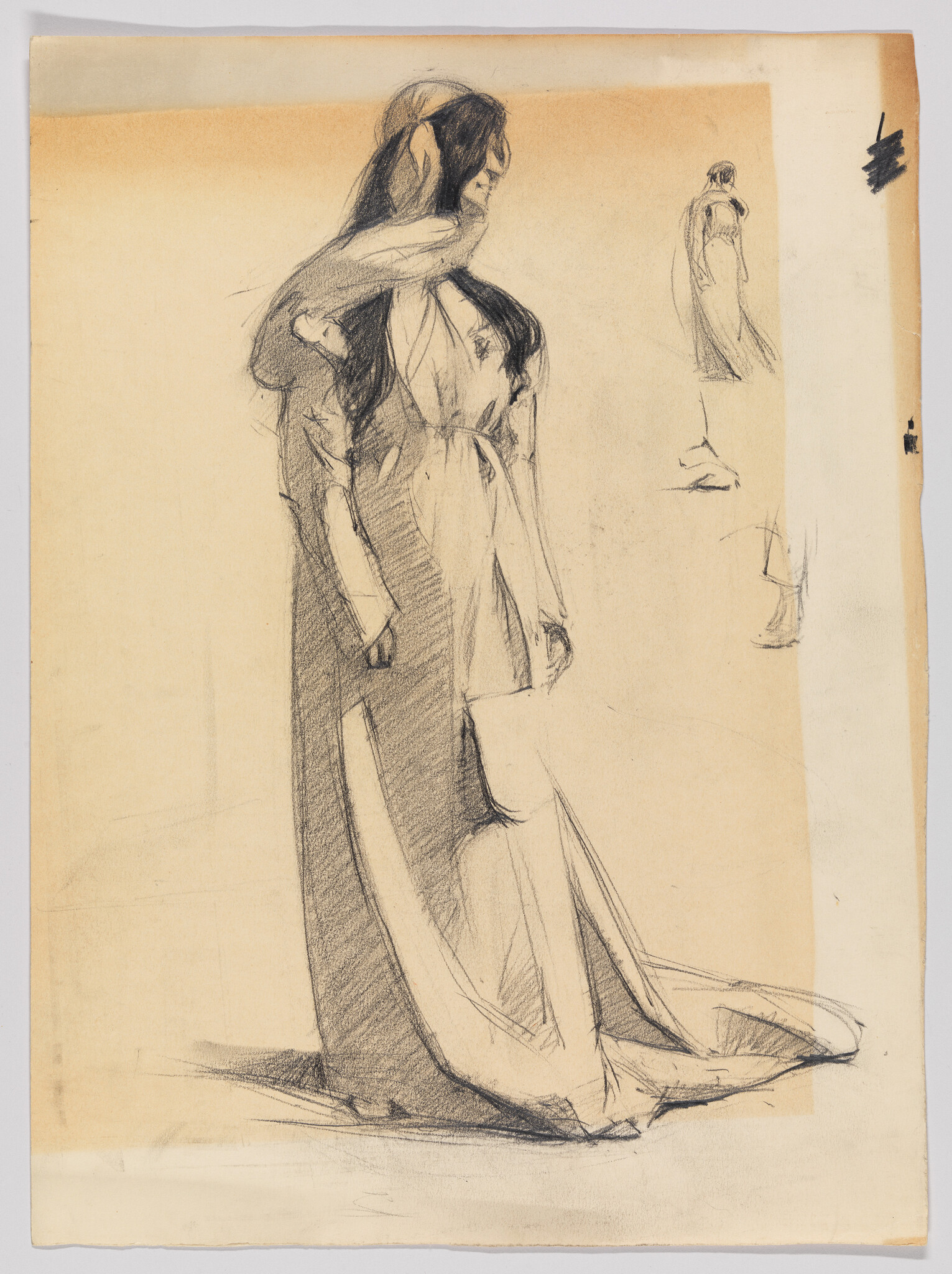 A woman in a long flowing gown stands with her head turned and hands at her sides.