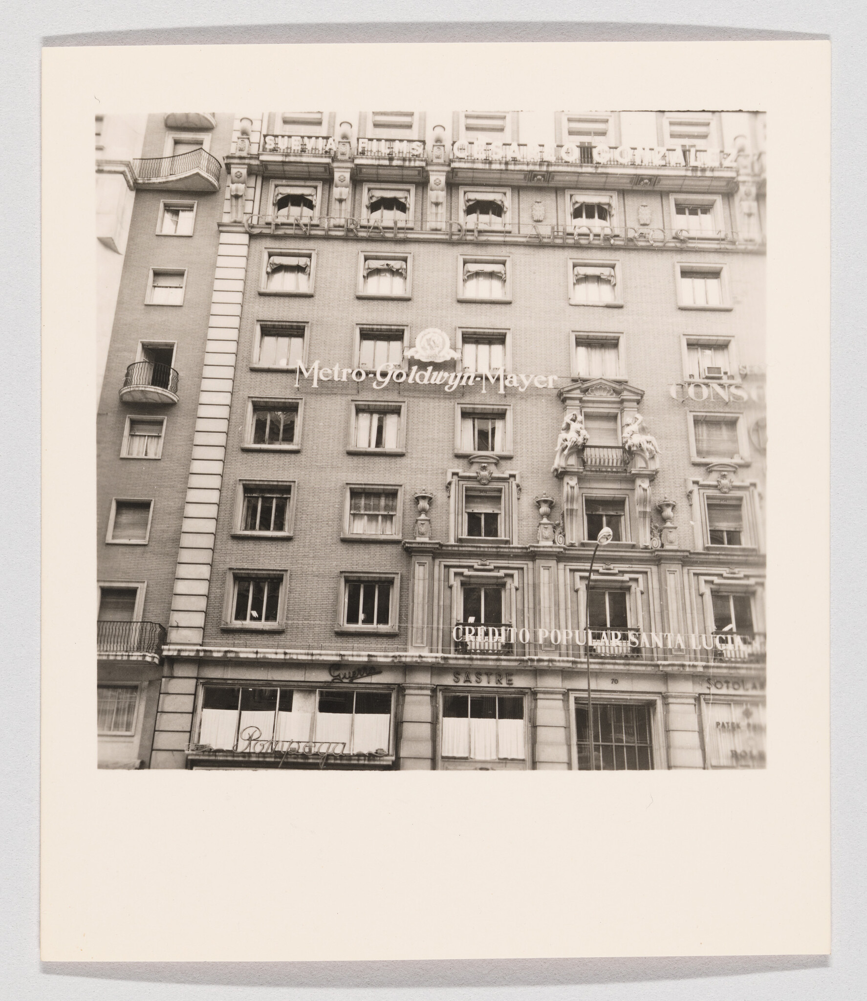 Tall urban building facade with Metro-Goldwyn-Mayer signage across the upper windows.