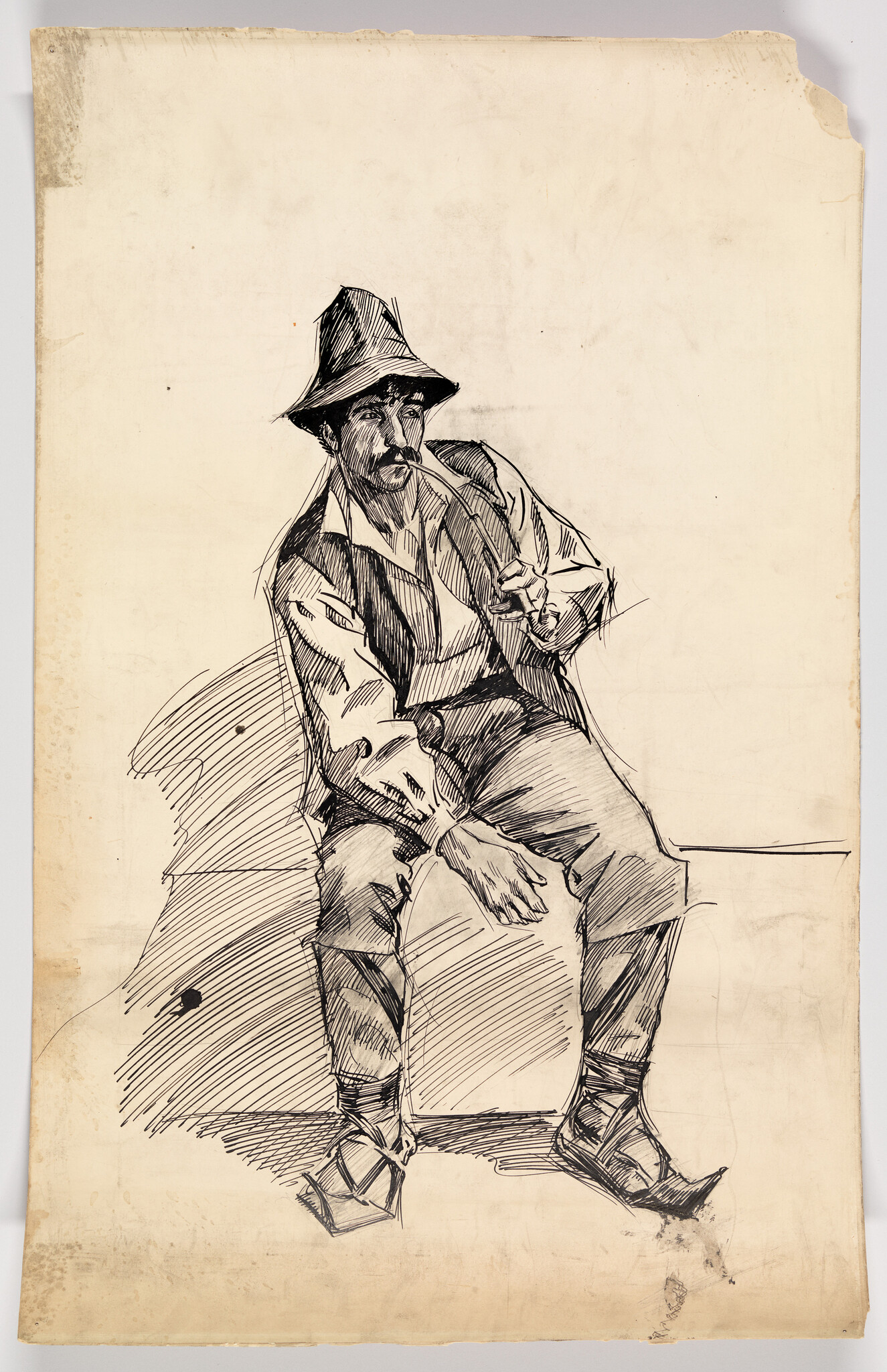 A seated man wearing a hat smokes a pipe while resting his arm on his knee.