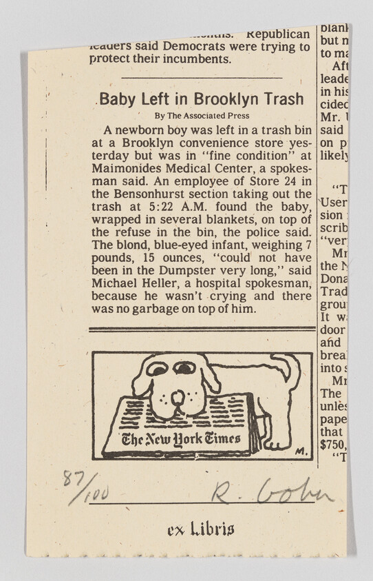 A newspaper clipping from The New York Times featuring an article titled "Baby Left in Brooklyn Trash" by The Associated Press. The article describes an incident where a newborn boy was found in a trash bin outside a Brooklyn convenience store, wrapped in blankets and in fine condition. Below the article is a small illustration of a dog lying down, with the newspaper's name inscribed underneath. Handwritten notations, "87/100" and "R. Cohn," along with the phrase "ex Libris," are visible at the bottom of the clipping.