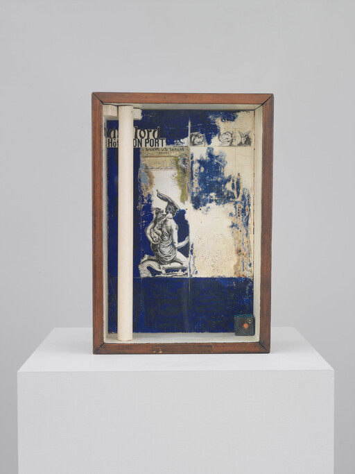 Wooden-framed shadow box with a blue collage featuring a kneeling classical figure and white column.