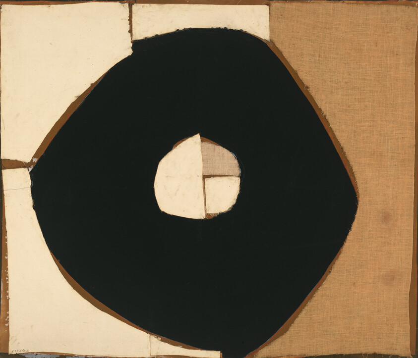 Large irregular black ring with a small pale center painted on patched beige canvas.