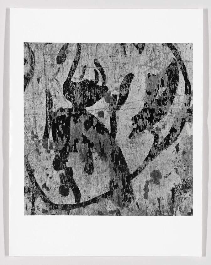Black and white abstract artwork with textured patterns, possibly on canvas, framed on a white background.