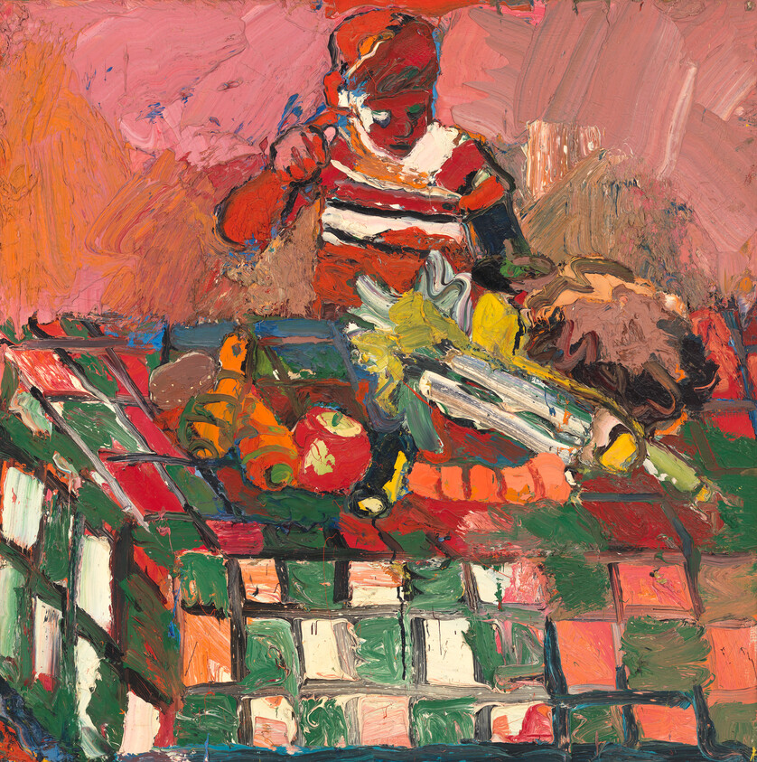 A child in a striped shirt reaches toward fruit and toys on a colorful table.