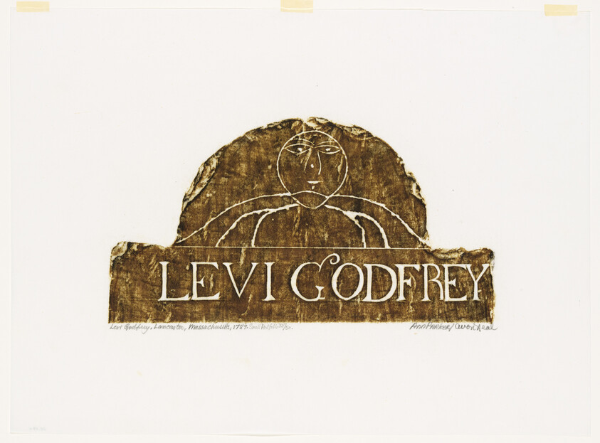 A carved wooden plaque with a simple carved face and the name Levi Godfrey.