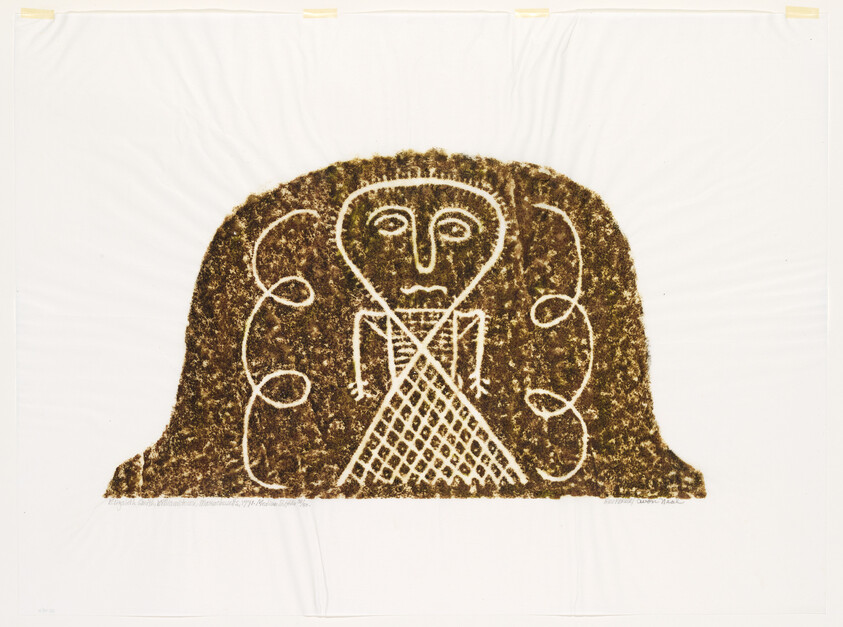 A textured artwork depicting a stylized human figure with a large head and facial features outlined in white on a dark brown, moss-like background. The figure has prominent eyes, a triangular nose, and a patterned body, with curved lines suggesting arms and hands. The piece is displayed against a white backdrop with visible mounting tape at the top.