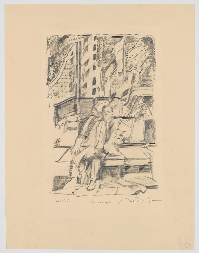 A man in a suit sits on a bench in a train car with city visible through the window.