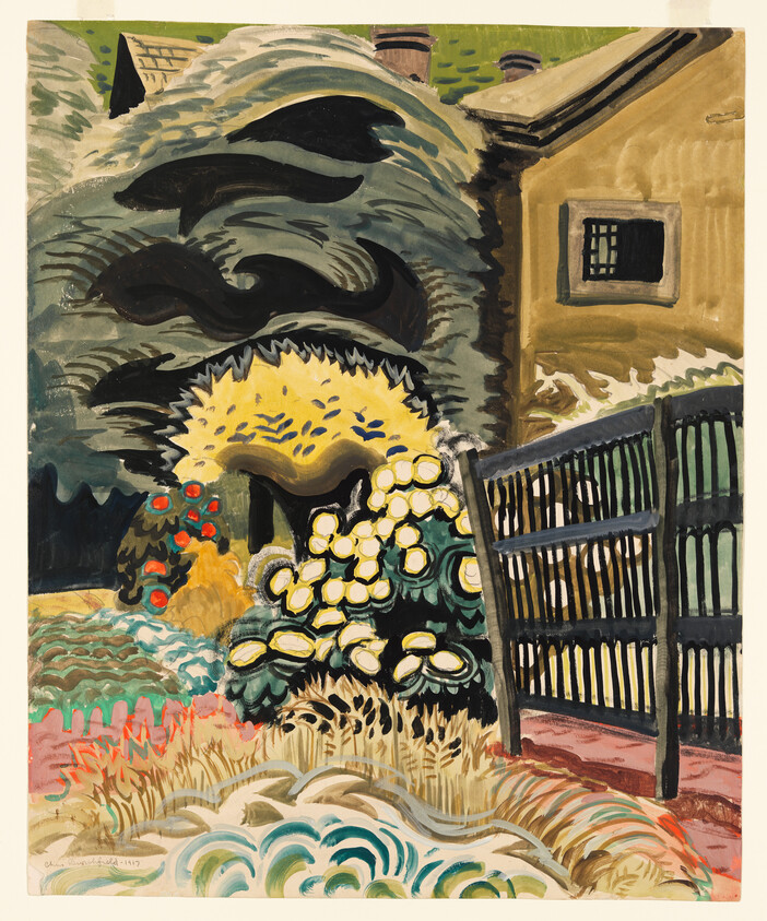 A vibrant expressionist painting depicting a garden scene with a yellow flowering bush in the foreground, surrounded by various plants in bold colors. The background features a dark, wavy hill with a house to the right, its roof and chimney just visible. A black fence with open slats stands to the right, contrasting with the bright garden. The brushstrokes are loose and dynamic, adding to the painting's lively atmosphere.